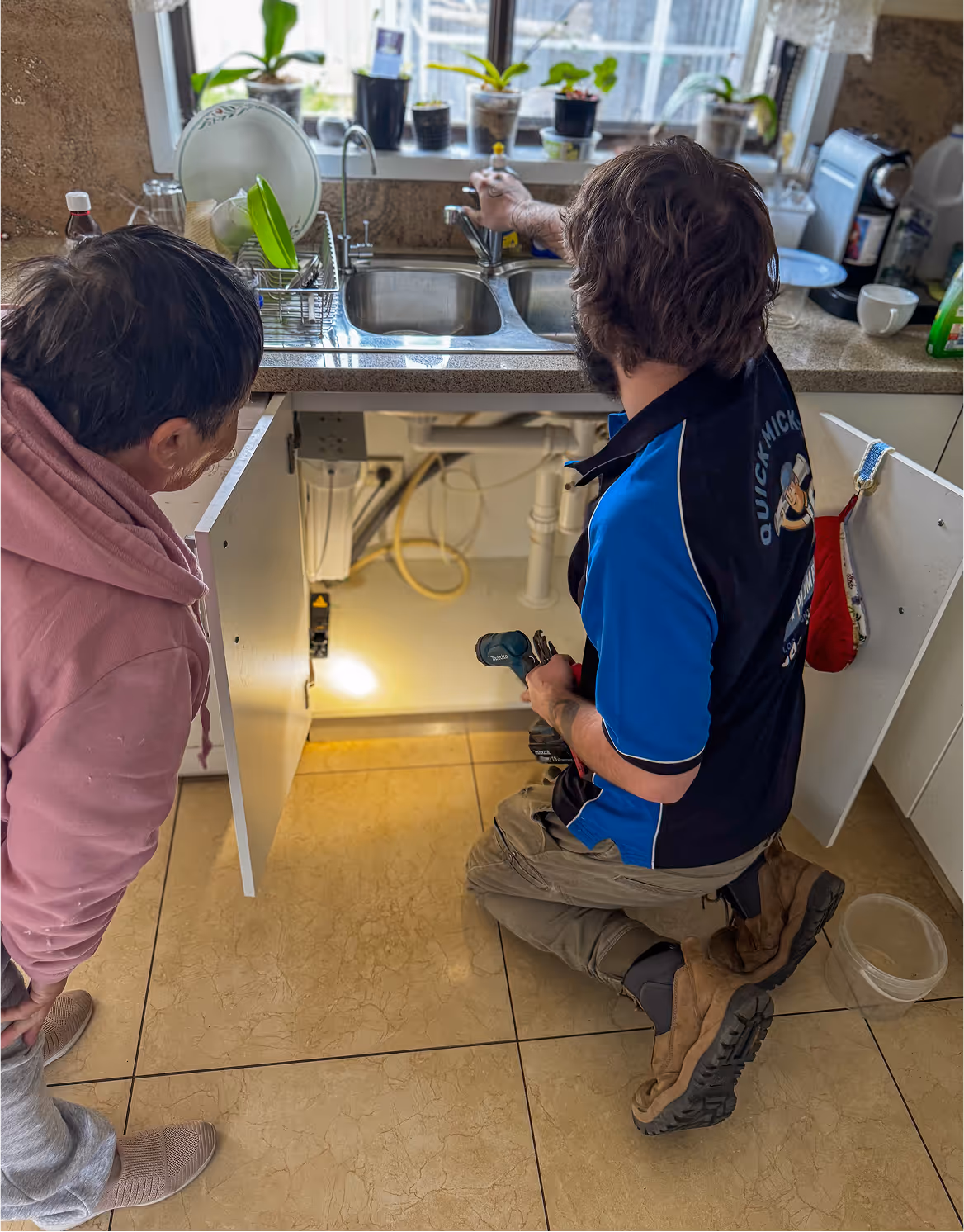 Matt showing the home owner why their drain is unblocked at their home in the blue mountains.