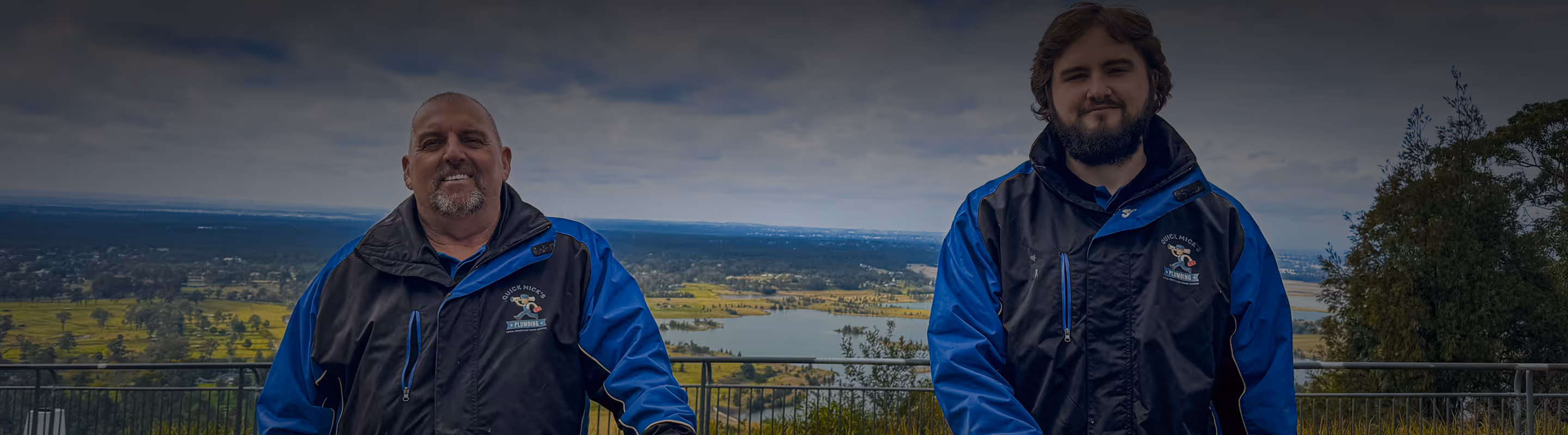 The Quick Mick’s Plumbing team next to their work ute at Katoomba Lookout